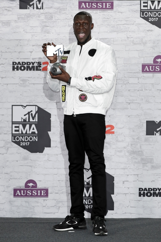 Worldwide Act award winner Stormzy poses in the winner's room.