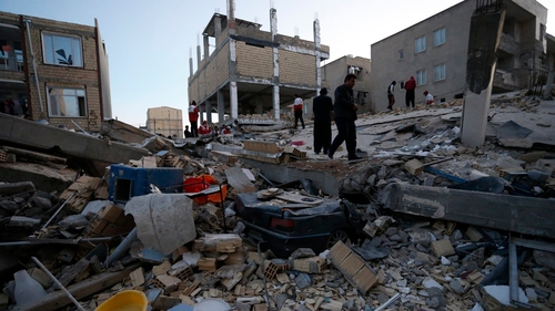 Rescue personnel carry out search and rescue work at Sarpol-e Zahab in Iran's Kermanshah province