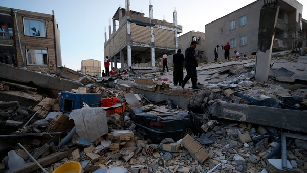 Rescue personnel carry out search and rescue work at Sarpol-e Zahab in Iran's Kermanshah province