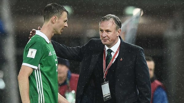 Jonny Evans (L) with Michael O'Neill