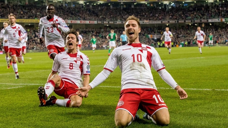 Christian Eriksen (R) has not given up on a return to international football