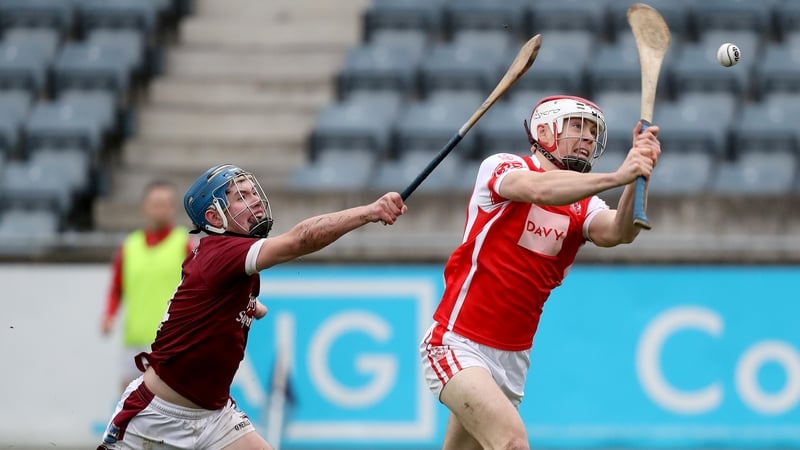 Con O'Callaghan scores a goal despite the tackle of St Martin's Conor Firman