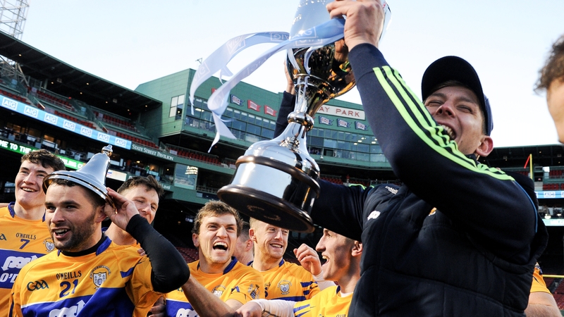 Clare players celebrate with the trophy