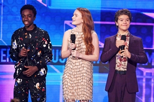 <p>Caleb McLaughlin, Sadie Sink, and Gaten Matarazzo speak onstage during the American Music Awards</p>