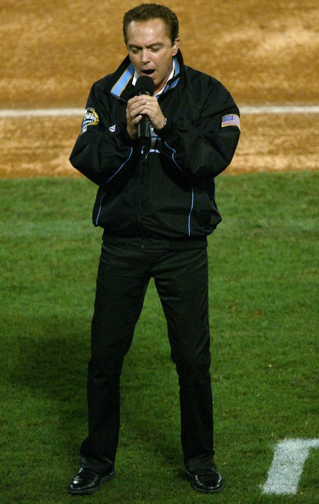 David Cassidy performs 'God Bless America' during the 7th inning stretch of game three of the Major League Baseball World Series between the Florida Marlins and the New York Yankees in 2003