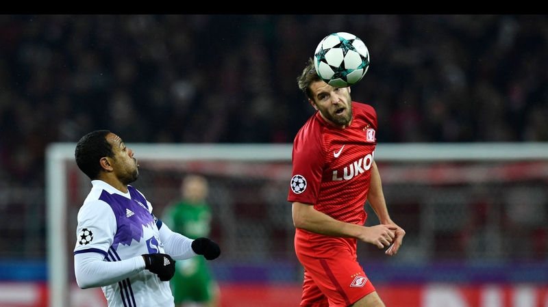 Maribor's Marcos Tavares and Spartak Moscow's Dmitry Kombarov vie for the ball