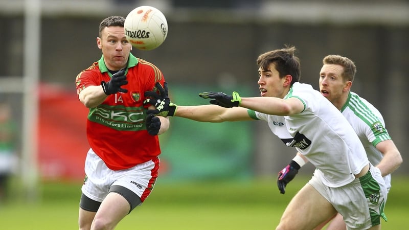 Former Wicklow star Leighton Glynn evades Mark Dempsey of Moorefield