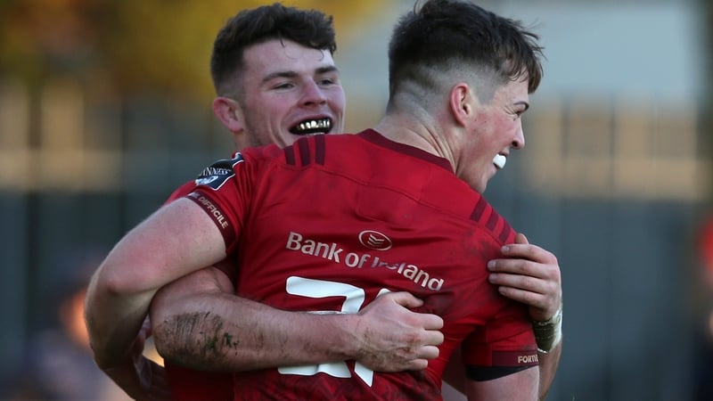 Calvin Nash and Jack Stafford (R) celebrate Nash's first try for Munster