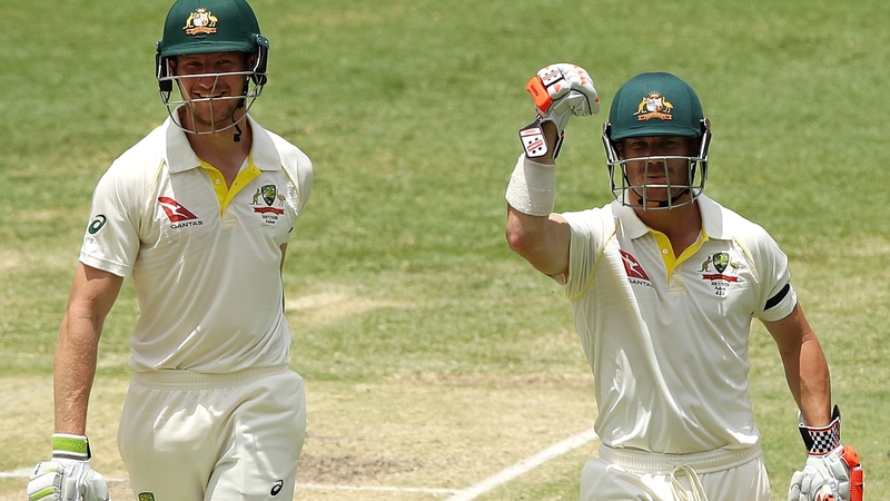 David Warner and Cameron Bancroft celebrate after winning the first Test