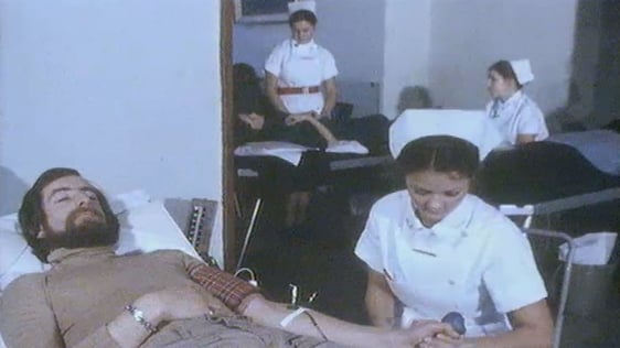 RTÉ reporter Mícheál Ó hUanacháin donates blood (1977)