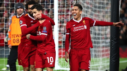 Mo Salah, Philippe Coutinho and Roberto Firmino celebrate at Anfield