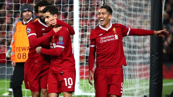 Mo Salah, Philippe Coutinho and Roberto Firmino celebrate at Anfield