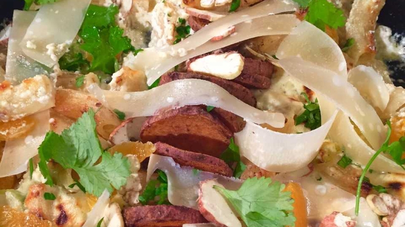 Arun's spiced sweet potato & Brussel ricotta rigatoni with clementine, chestnut topping, zesty green relish.