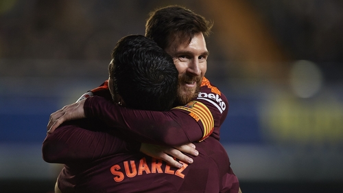 Lionel Messi and Luis Suarez celebrate a goal against Villarreal.