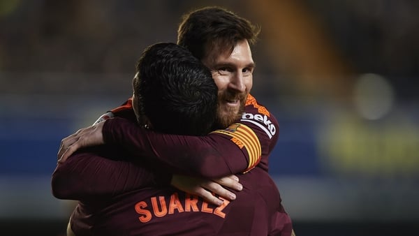 Lionel Messi and Luis Suarez celebrate a goal against Villarreal.