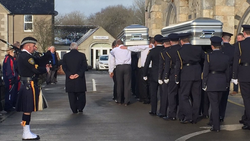 A piper and officers from the Chicago police department are in attendance at the funeral