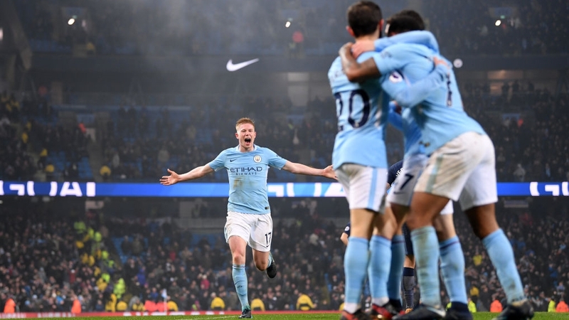 Manchester City players celebrate after Raheem Sterling scores their third goal