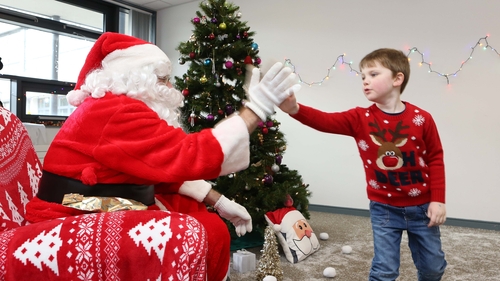 A high five for Santa. Photo: Aengus McMahon