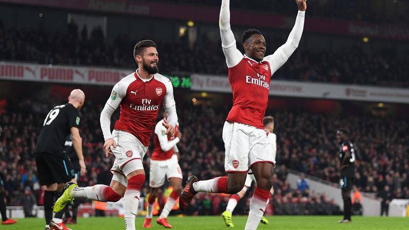 Danny Welbeck celebrates Arsenal's winner to move into the last four of the competition