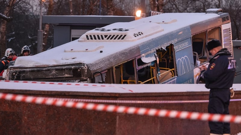 Rescuers pull out the bus after it ploughed into a pedestrian underpass in Moscow