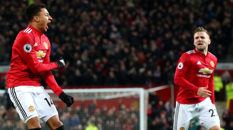 Jesse Lingard (L) celebrates his leveller