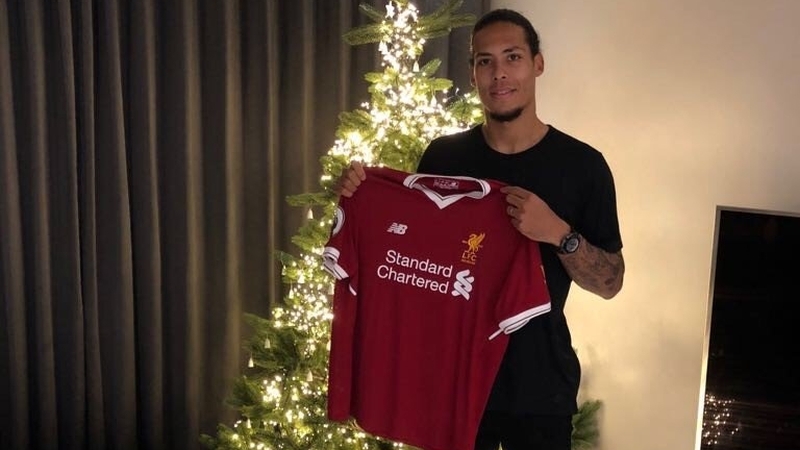 Virgil van Dijk posing with his new strip