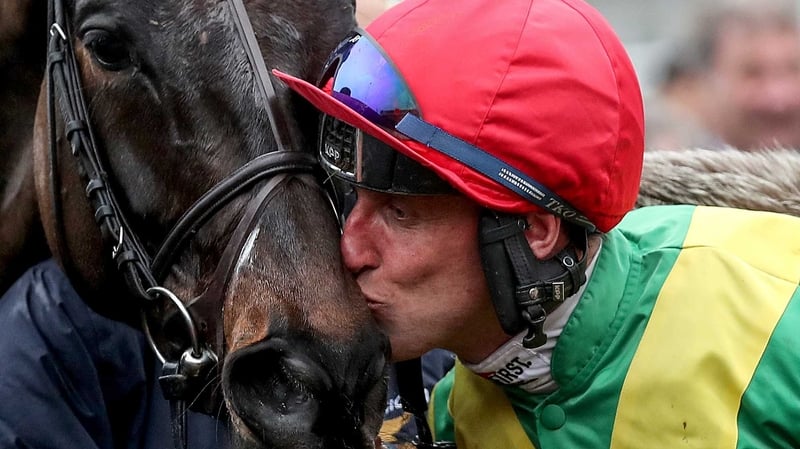 Robbie Power celebrates last year's Cheltenham Gold Cup success with Sizing John