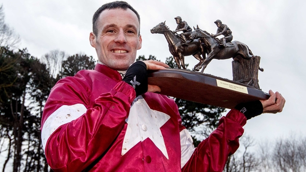 Sean Flanagan celebrates after riding Road To Respect to success in the Christmas Chase
