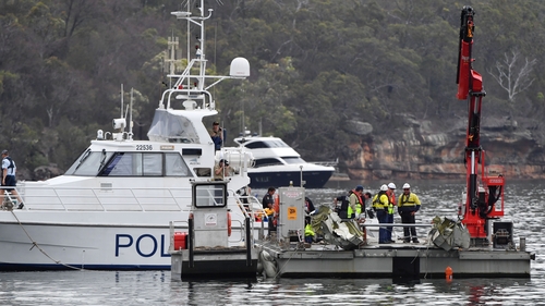 Search teams are working to remove the wreckage from the water