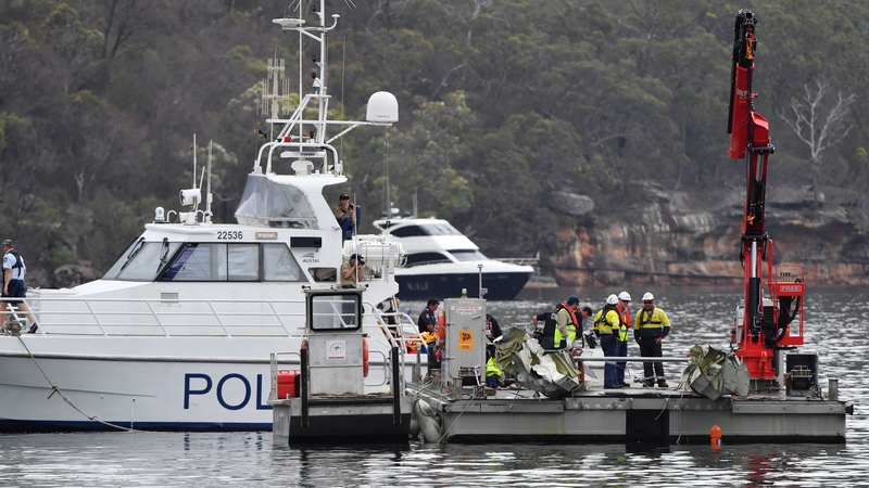 Search teams are working to remove the wreckage from the water