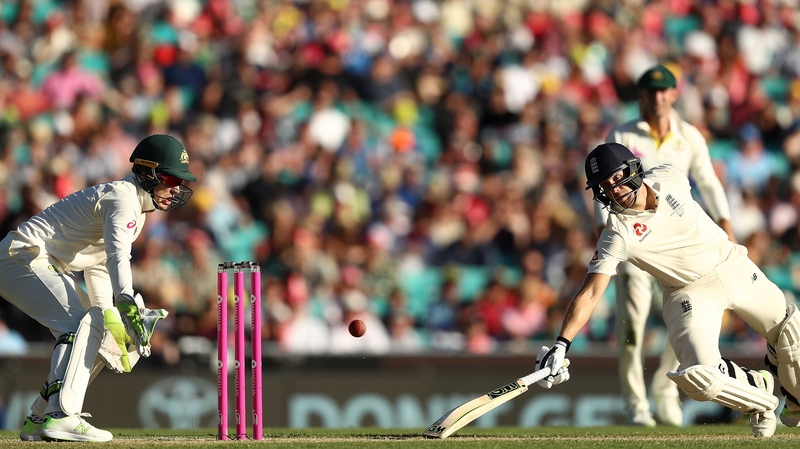 Dawid Malan of England dives to make his ground