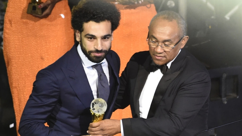 Confederation of African Football President Ahmad Ahmad (R) presents The African Footballer of the Year Award to Mohamed Salah