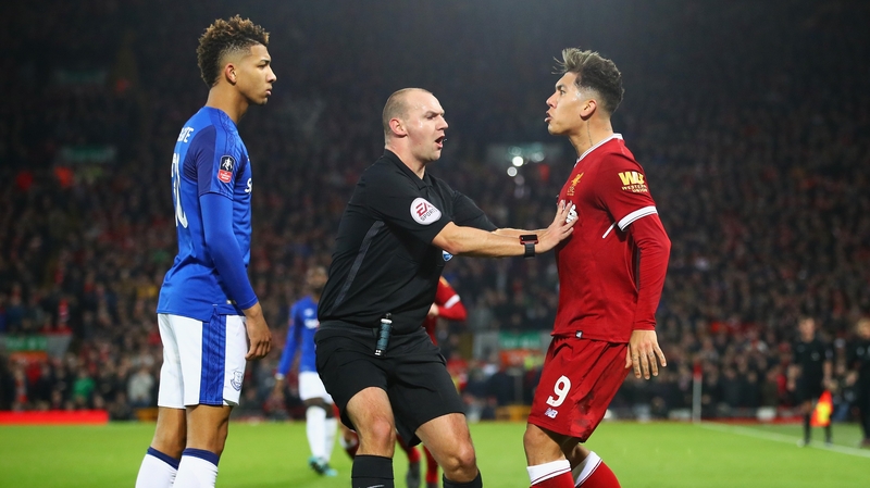 Mason Holgate and Roberto Firmino clash in the FA Cup third round tie at Anfield