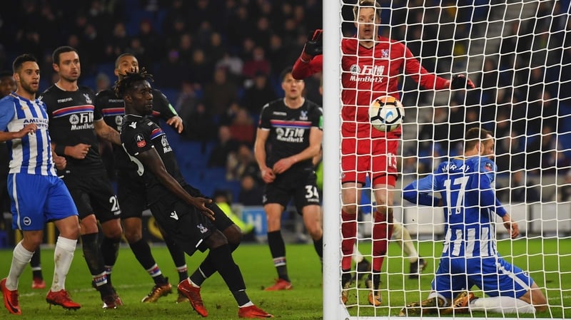 Glenn Murray slides into the net as he scores the winner