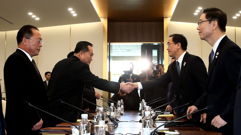 South Korea Unification Minister Cho Myung-Gyun (2nd R) shakes hands with North Korean chief delegate Ri Son-Gwon (2nd L)