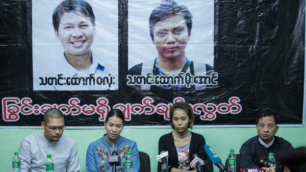 Pan Ei Mon (C-L), wife of Wa Lone, and Nyo Nyo Aye (C-R), sister of Kyaw Soe Oo, speaking at a press briefing on 28 December