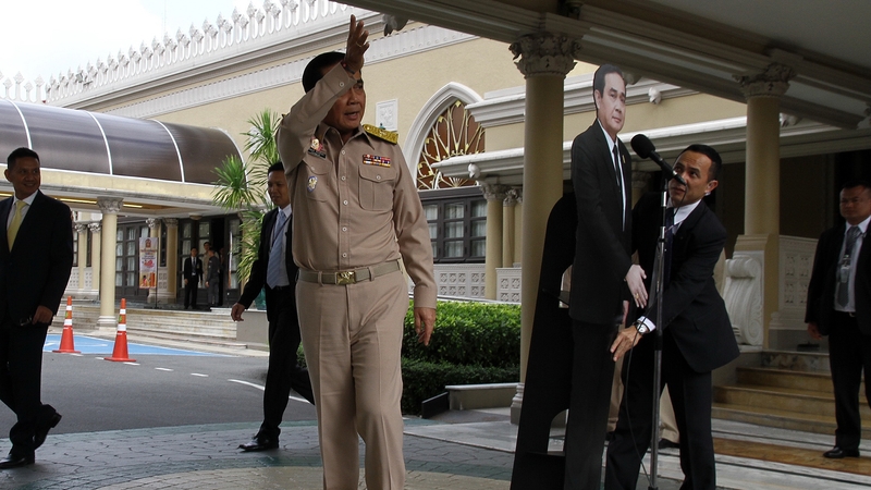 Prayuth Chan-ocha exits the stage, leaving the cut-out to 'answer questions'