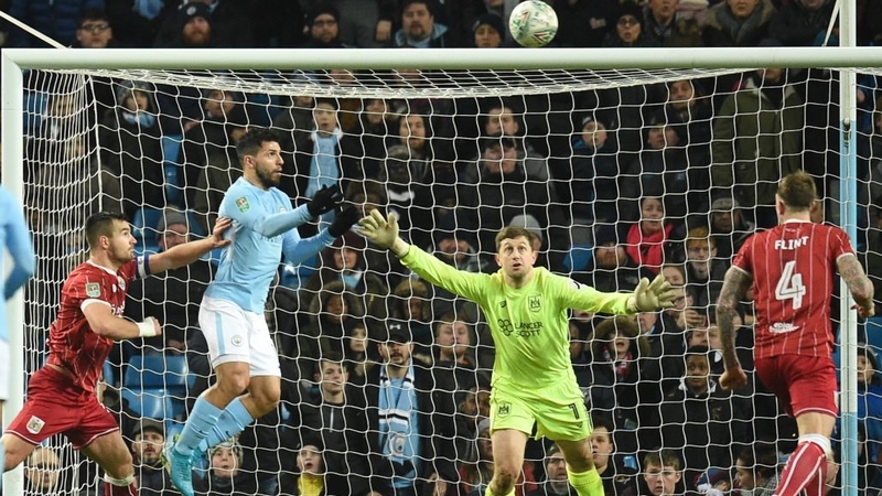 Sergio Aguero leaps to score the winner