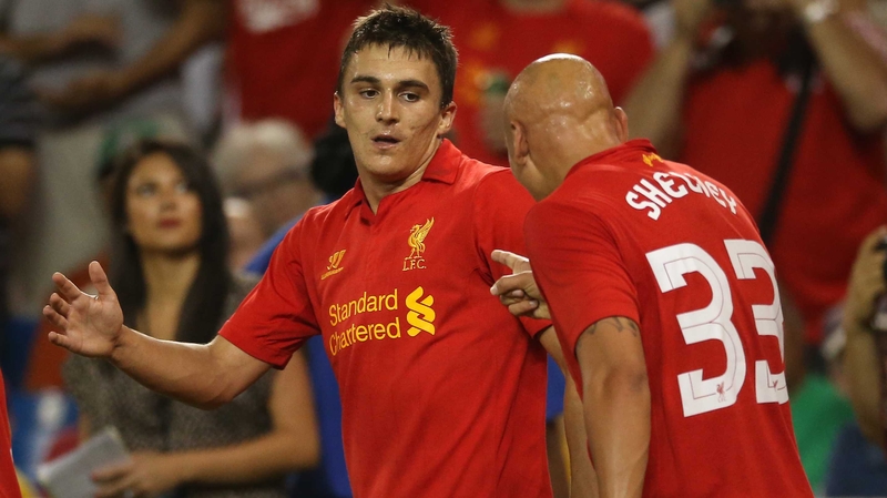 Adam Morgan in action for Liverpool with Jonjo Shelvey