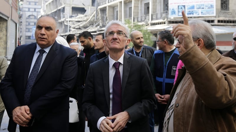 UN humanitarian chief Mark Lowcock (C) during visit to Syrian city of Homs