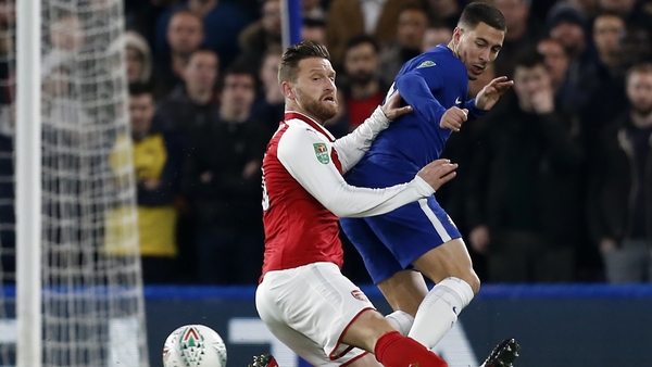 Shkodran Mustafi and Eden Hazard battle for possession