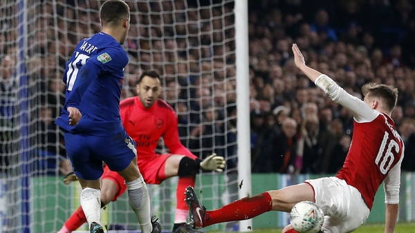 Rob Holding gets in a lunging tackle on Eden Hazard in the goalless draw at Stamford Bridge