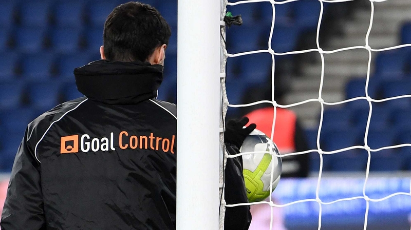 A man from German company GoalControl checking the operation of the goal-line technology before the clash between Paris Saint-Germain and Caen at the Parc des Princes on 20 December