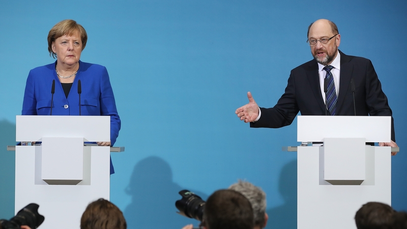 SPD leader Martin Schulz (R) with Chancellor Angela Merkel (L)