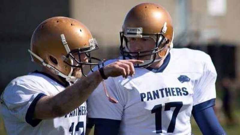 Eamon Fennell gets instructions during an American football game in Dublin