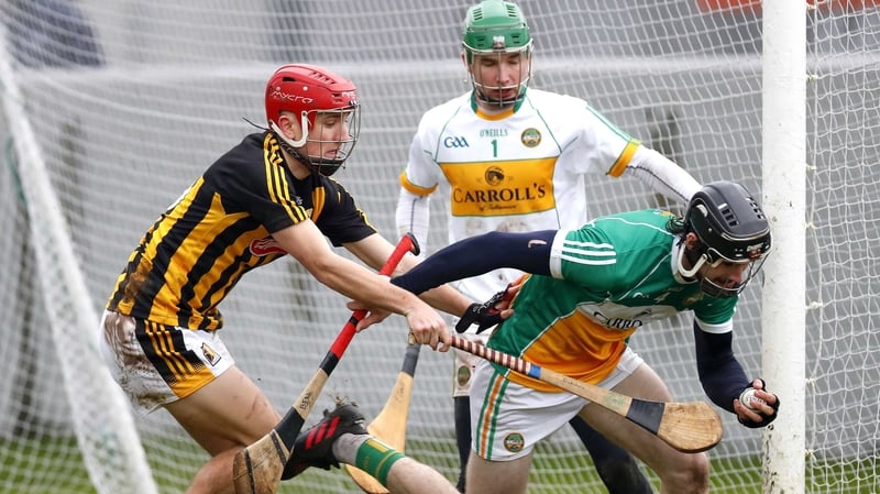 Offaly's Ben Conneely and Bill Sheehan of Kilkenny tussle for possession