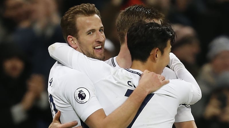 Harry Kane is swamped by his team-mates after netting against Everton