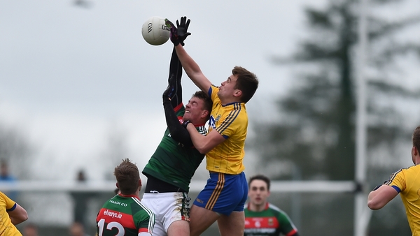 Enda Smith and Danny Kirby tussle in Roscommon's clash with Mayo in the FBD League