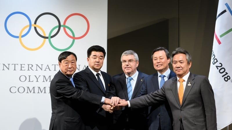 IOC President Thomas Bach alongside representatives from North Korea and South Korea at today's talks in Switzerland