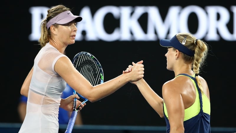 Angelique Kerber of Germany is congratulated by Maria Sharapova